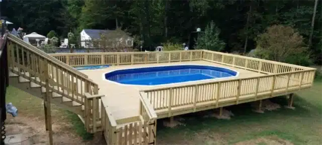 Photo of a multi-level deck that leads down to a pool deck.