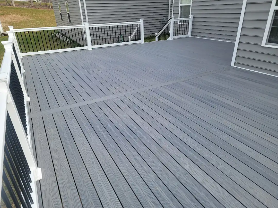 Photo of a composite deck with deck railing and balusters.