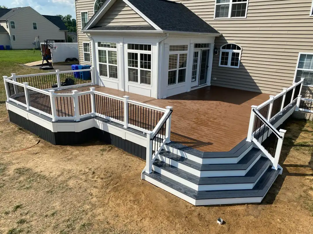 Photo of a composite deck with white railing and black baluster - deck remodeling and deck resurfacing contractor in maryland - custom deck builders in great mills md