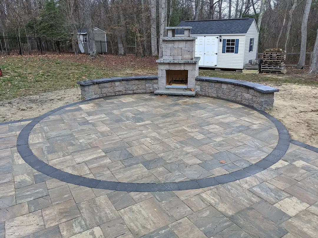 Photo of a paver patio with outdoor stone fireplace