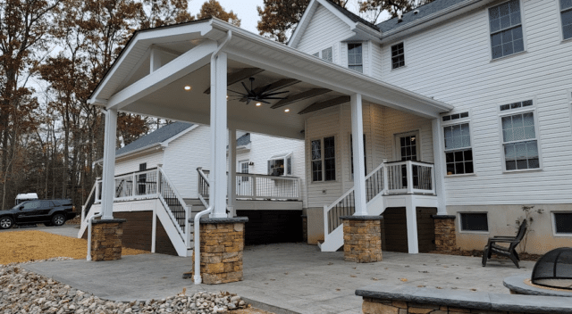 open-air porch with deck, patio, columns, and stone bases - Porch Design Ideas