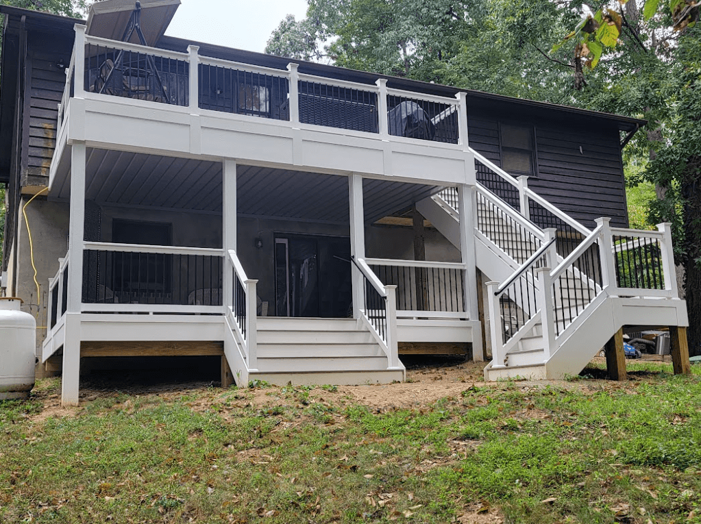 Photo of a multi-level deck with a water diversion system that creates a usable area under the second-story deck - Underdeck Water Diversion and space optimization ideas for composite decks