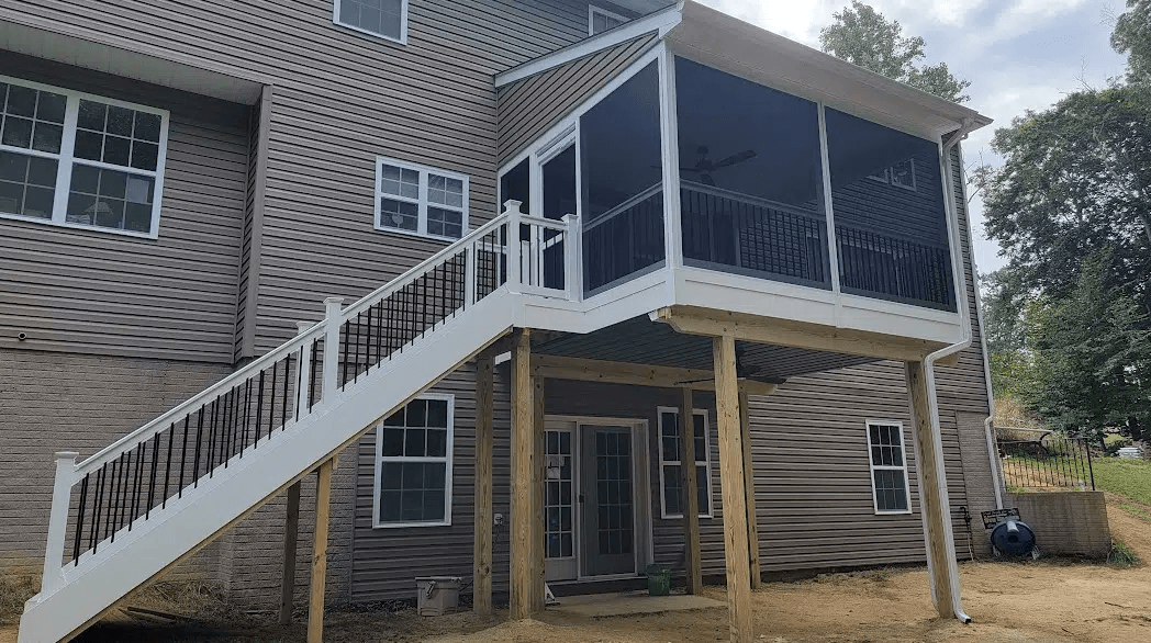 photo of a covered deck that is screened in and elevated - Covered Deck Builders in Southern Maryland