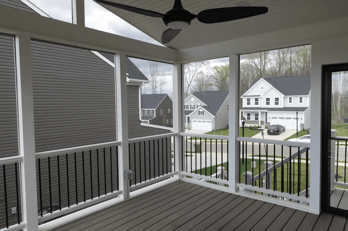 Screened-in covered deck with solid roof and ceiling fan - Custom Covered Deck Builders in Southern Maryland